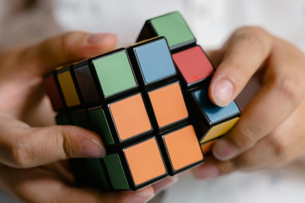 Photo by MART  PRODUCTION: https://www.pexels.com/photo/a-person-playing-with-a-rubiks-cube-8471996/