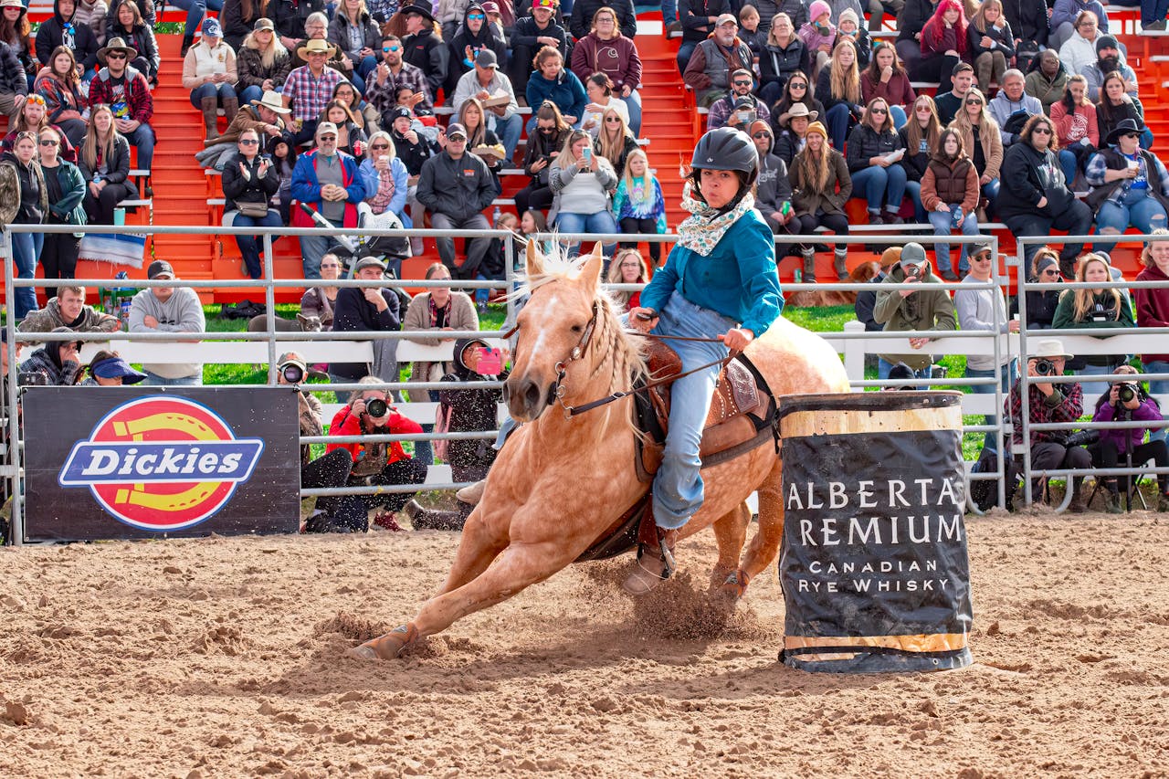 Photo by @coldbeer: https://www.pexels.com/photo/dynamic-barrel-racing-at-outdoor-rodeo-event-30941581/