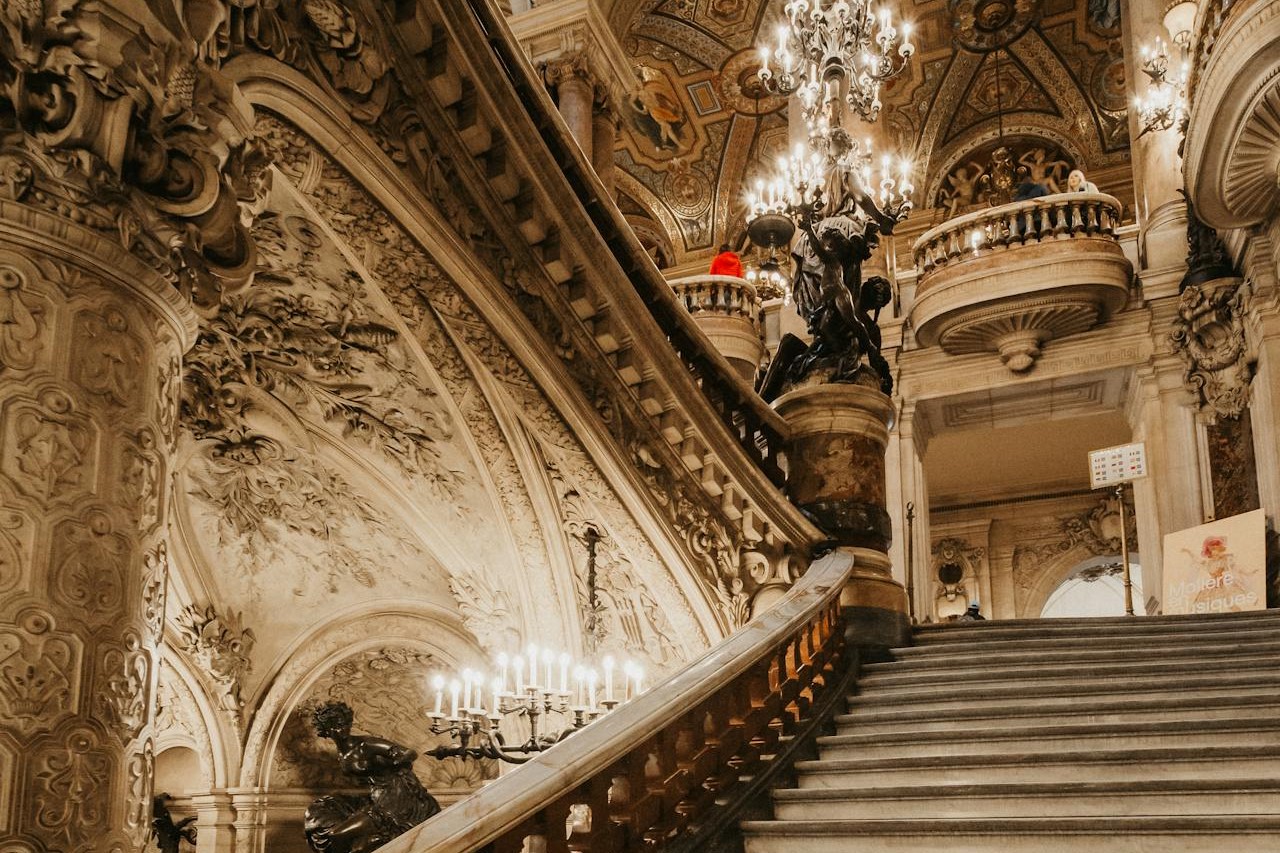Photo by Masood Aslami: https://www.pexels.com/photo/staircase-in-opera-garnier-19235979/